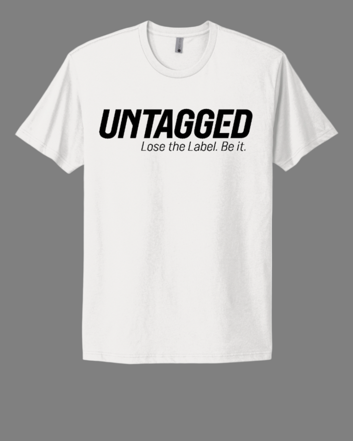 White t-shirt with 'UNTAGGED Lose the Label. Be it.' text on a white background