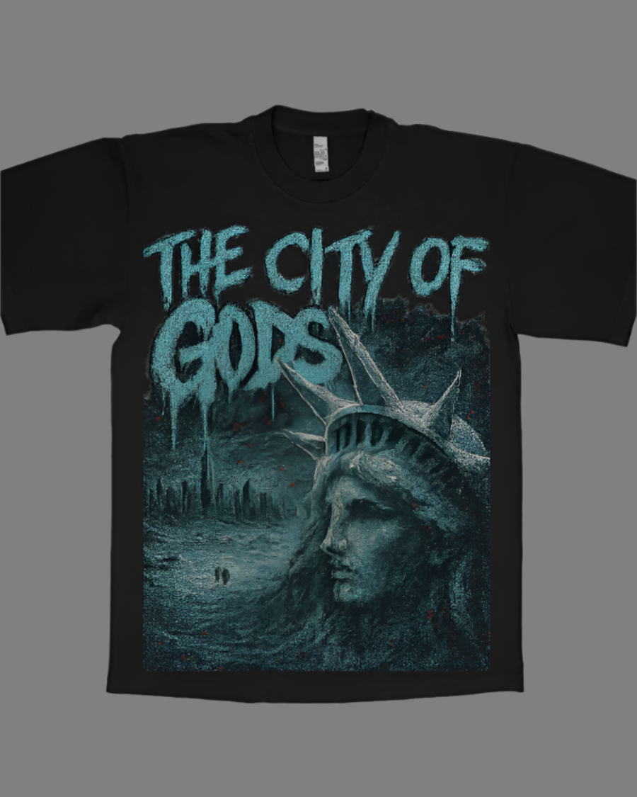 Black t-shirt with 'The City of Gods' text and Statue of Liberty graphic on a dark background