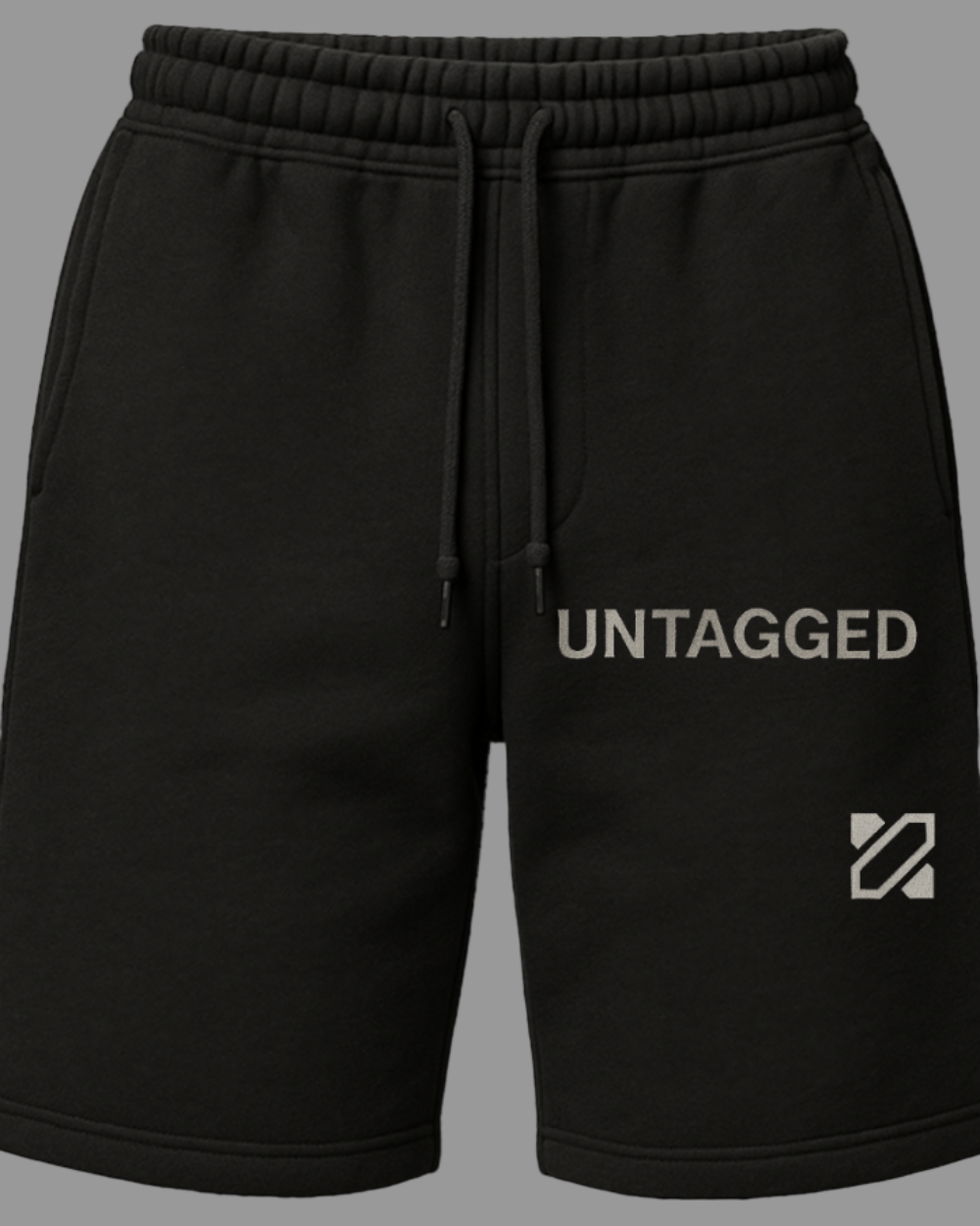 Black shorts with 'Untagged' branding on a white background