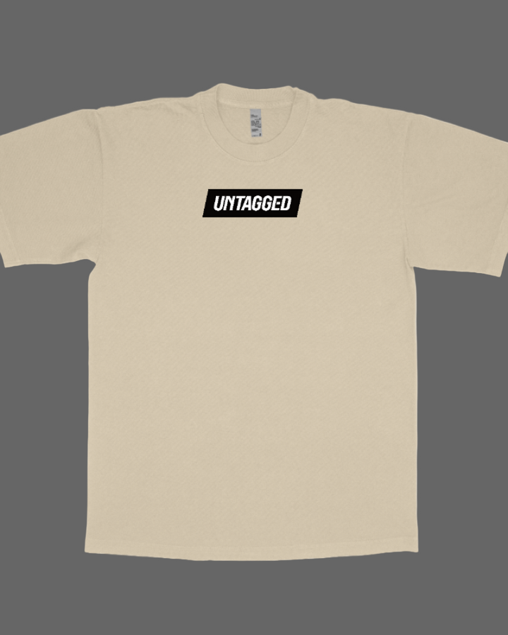 Beige t-shirt with 'UMTAGGED' logo on a white background