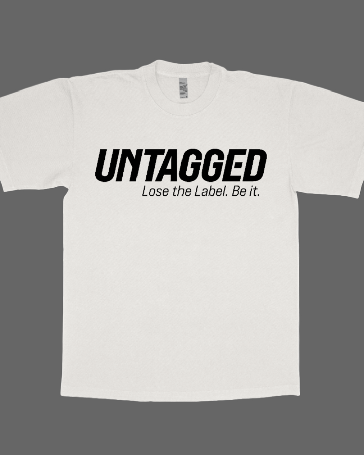 White t-shirt with 'UNTAGGED Lose the Label. Be it.' text on a white background