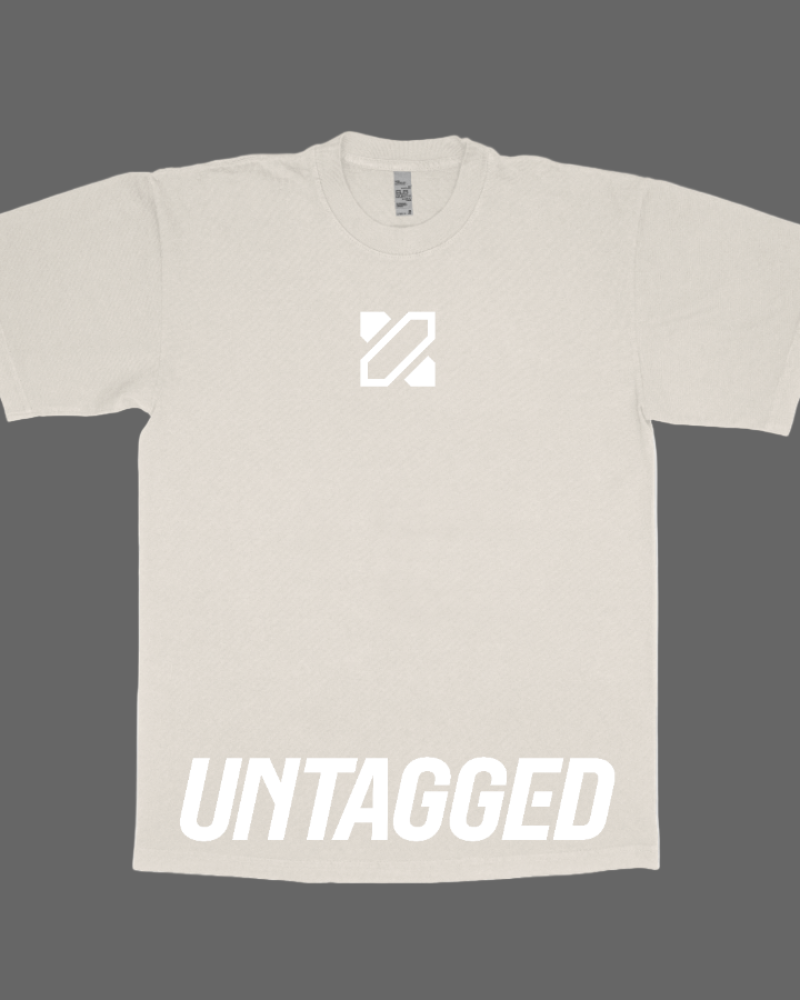 Beige t-shirt with a logo and 'UNTAGGED' text on a dark background
