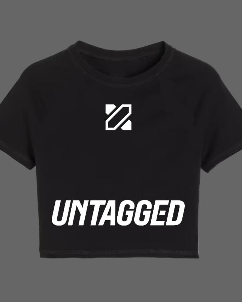 Black crop top with 'UNTAGGED' text and logo on a white background