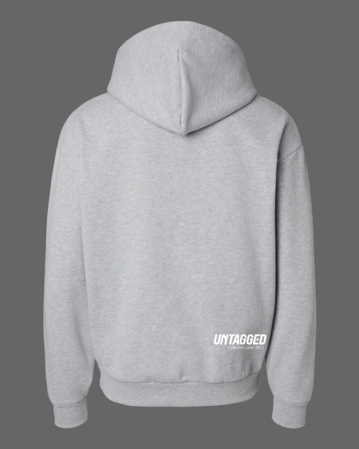 Gray hoodie with 'UNTAGGED' text on the back against a white background