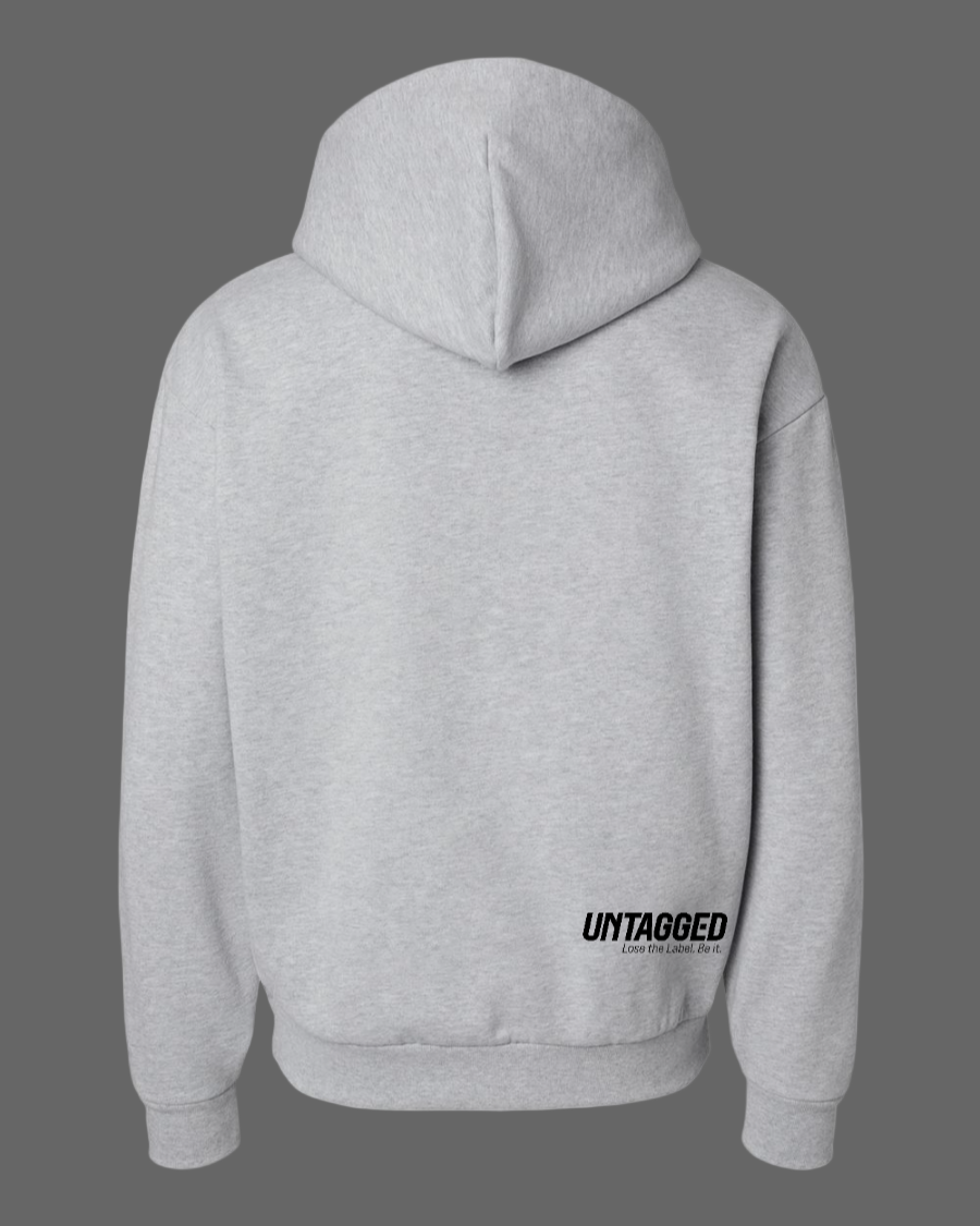 Gray hoodie with 'UNTAGGED' text on the back against a white background