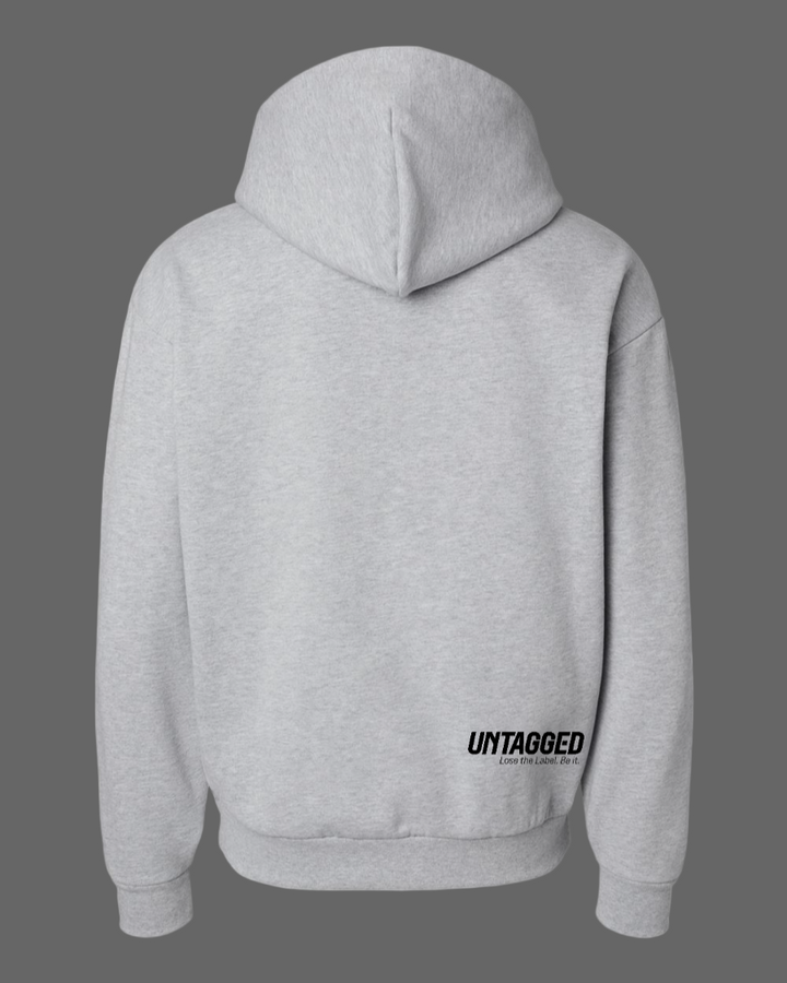 Gray hoodie with 'UNTAGGED' text on the back against a white background