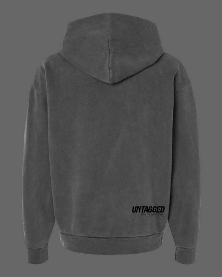 Gray hoodie with 'UNTAGGED' text on the back against a white background