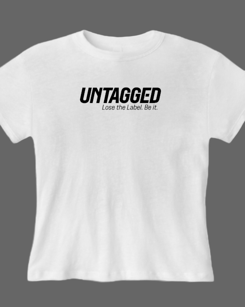 White t-shirt with 'UNTAGGED Lose the Label. Be it.' text on a white background