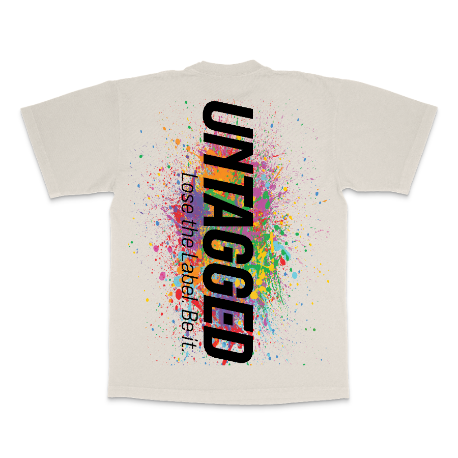 Beige t-shirt with colorful splatter design and 'UNTAGGED' text on a white background