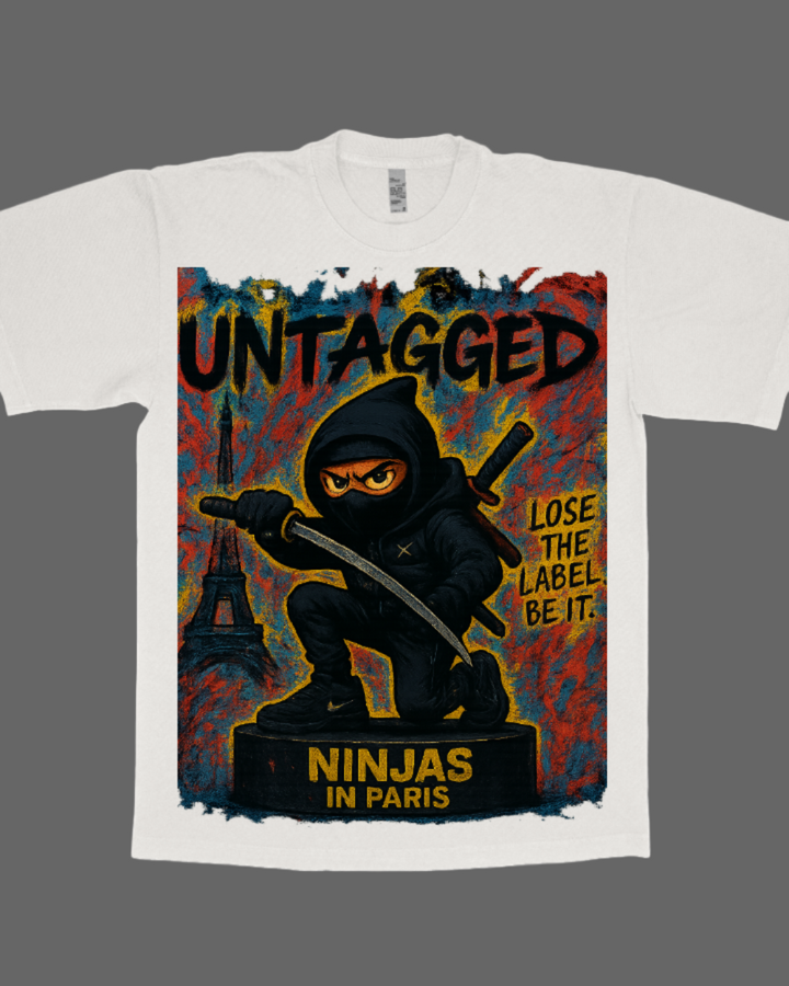 White t-shirt with a graphic design of a ninja and text 'Untagged Ninjas in Paris' on a white background