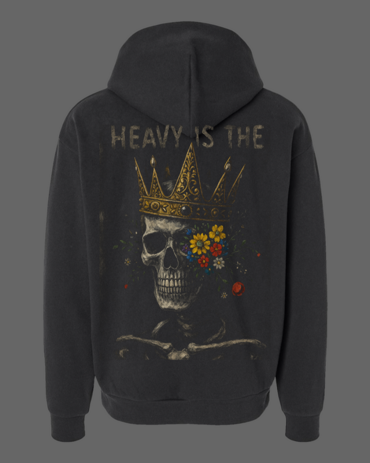 Black hoodie with a skull and crown design on the back, featuring the text 'HEAVY IS THE'.