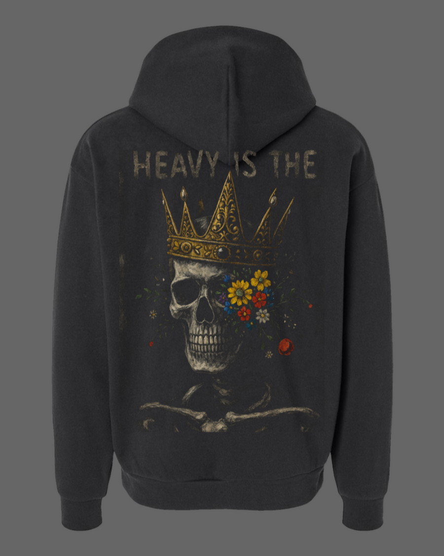 Black hoodie with a skull and crown design on the back, featuring the text 'HEAVY IS THE'.