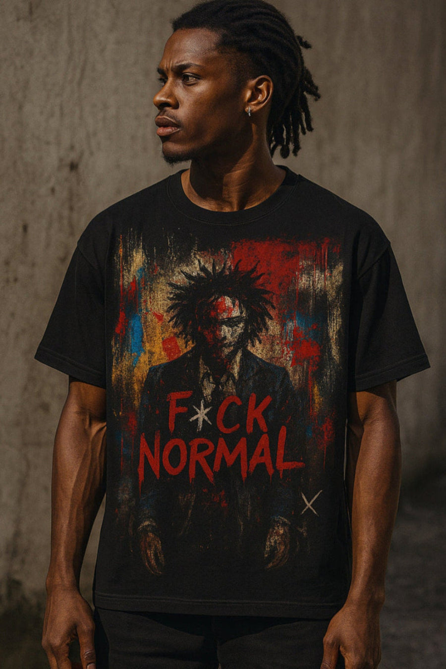 Person wearing a black t-shirt with a graphic design and text against a textured wall.