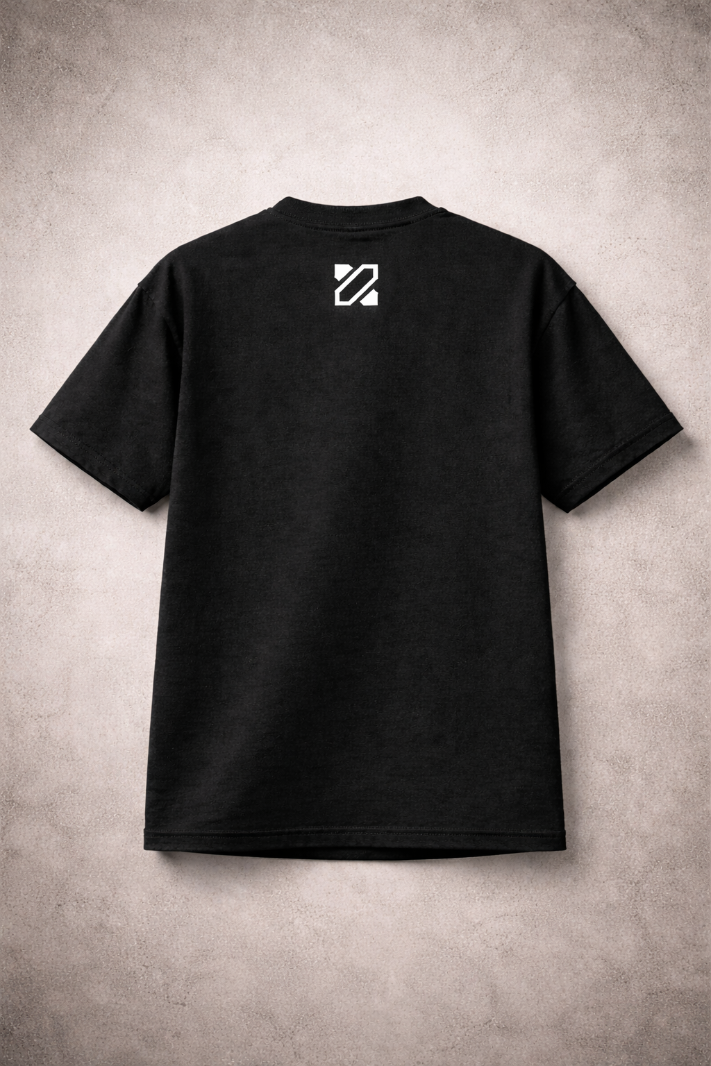 Black t-shirt with a white logo on the back against a textured beige background