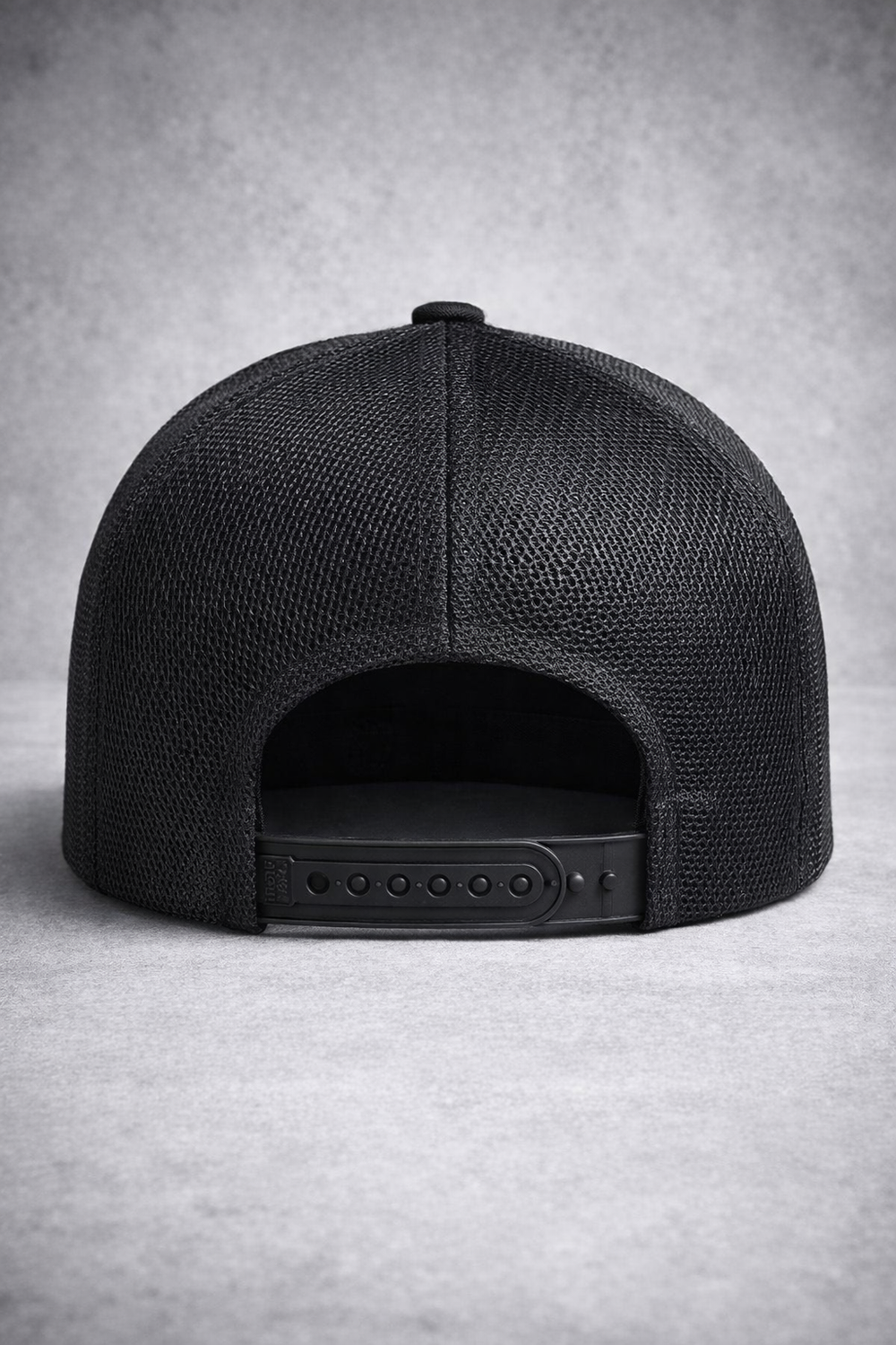 Black mesh cap on a gray background