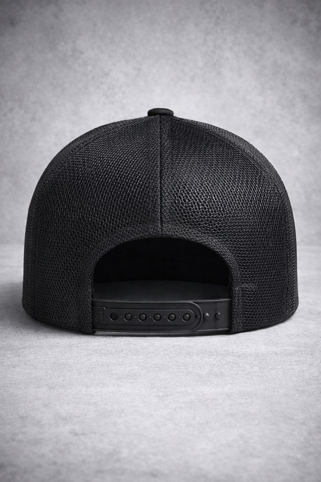 Black mesh cap on a gray background