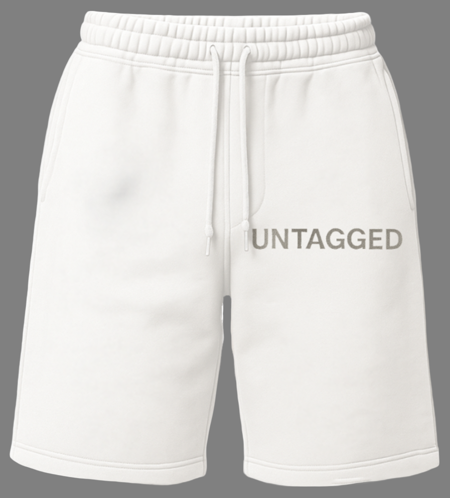 White shorts with 'UNTAGGED' text on a white background