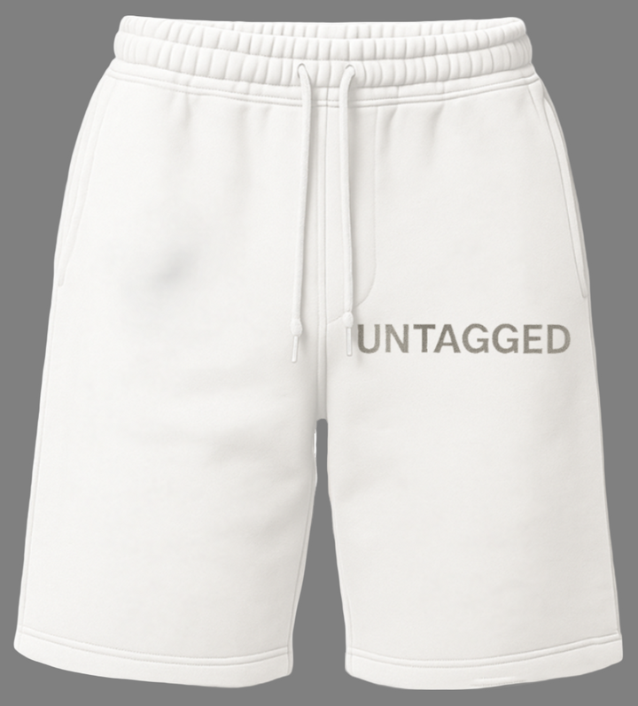 White shorts with 'UNTAGGED' text on a white background
